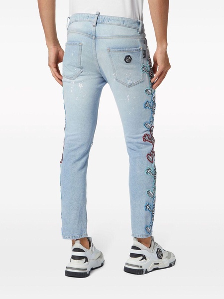 Skully Gang low-rise skinny jeans