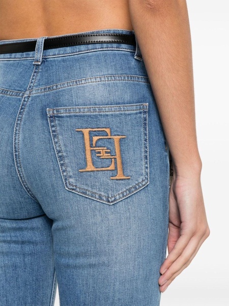 monogram-embroidered bootcut jeans