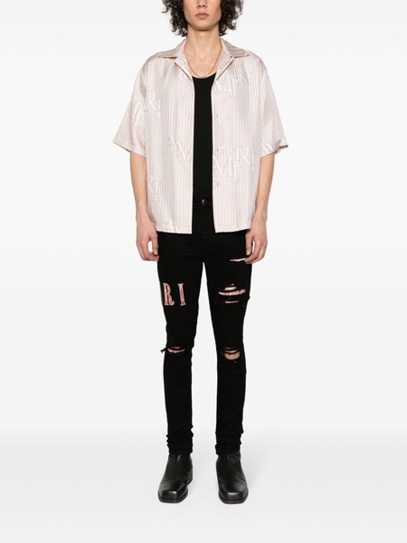 Black Waxed Logo-Appliqué Skinny Jeans