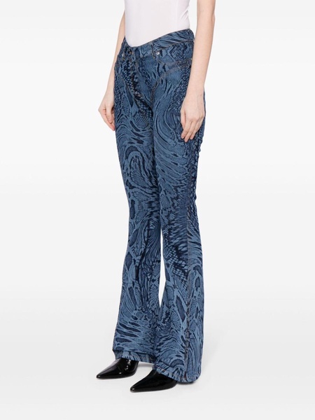 snake-print flared jeans