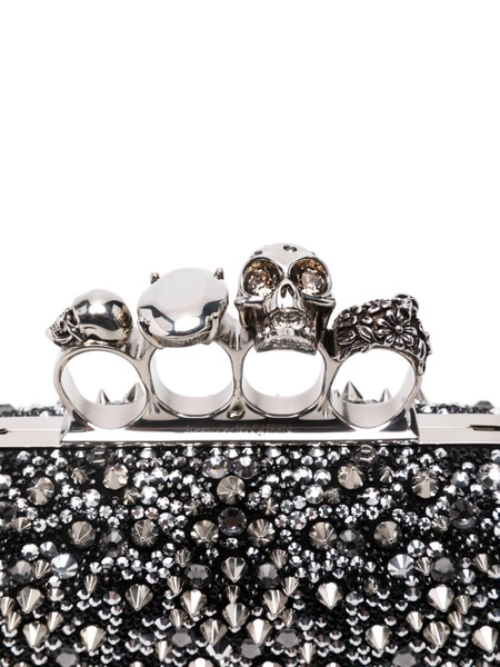 Knuckle embellished leather clutch