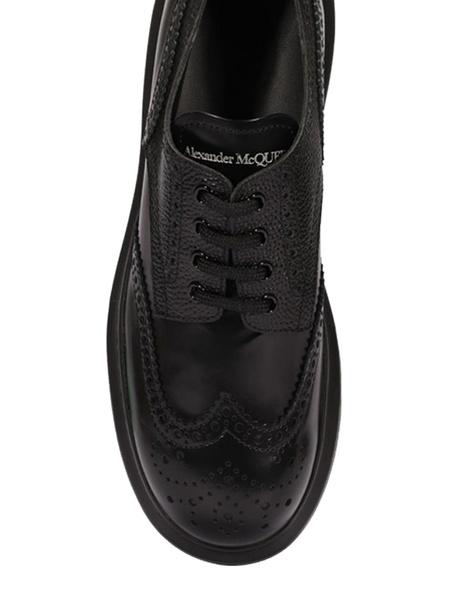 Brogue insert black leather lace-ups