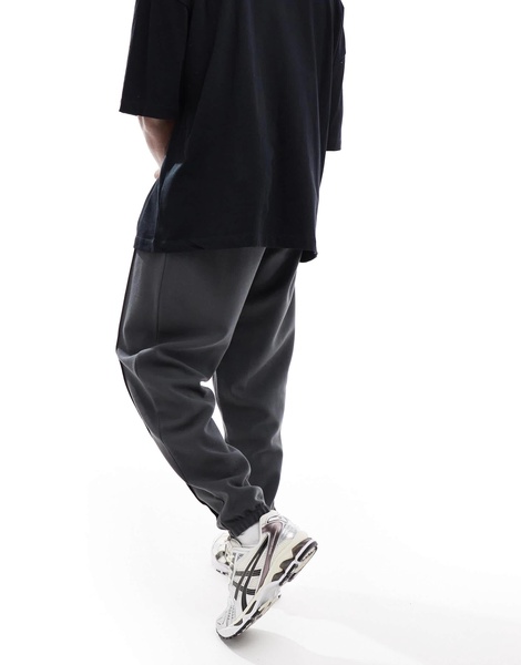 ASOS DESIGN oversized twill jersey sweatpants with pintucks in washed black