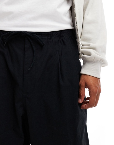 Nike Club woven balloon pants in black