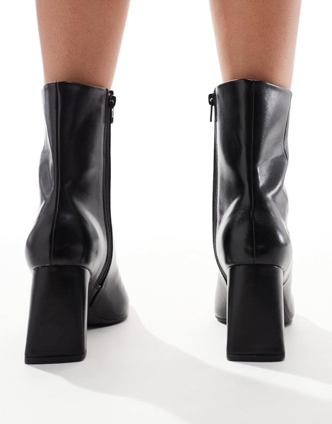 ASOS DESIGN Reach set back mid heel boots in black