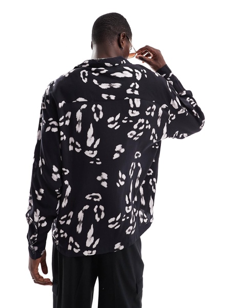 ASOS DESIGN oversized revere shirt with leopard print in black