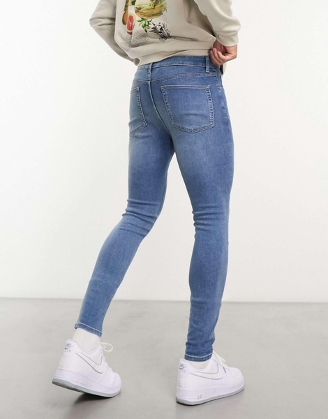 ASOS DESIGN power stretch jeans in mid wash