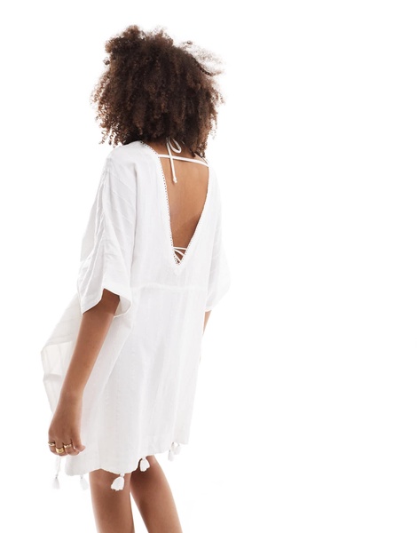 Accessorize beach cover up in white