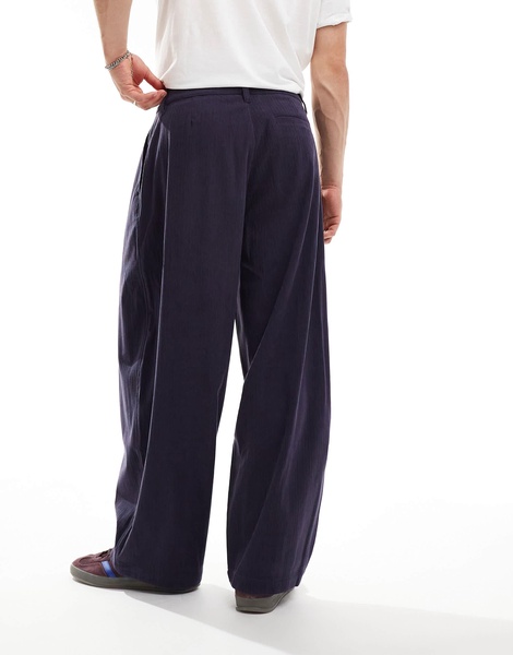 ASOS DESIGN baggy balloon fit cord pants with pleats in navy blue