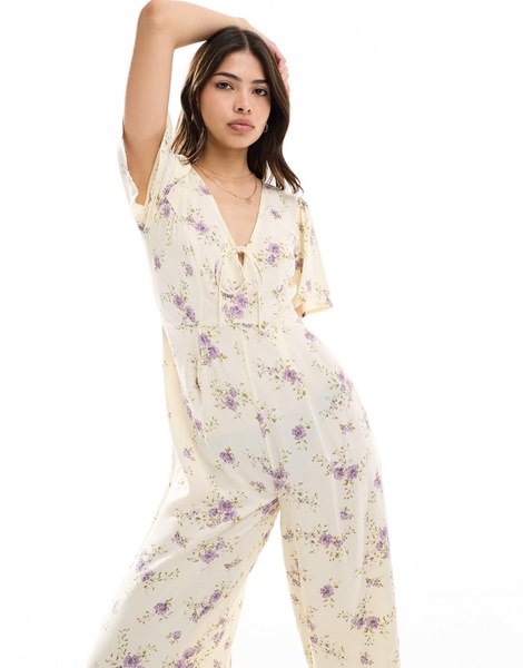 ASOS DESIGN spun flutter sleeve wide leg jumpsuit in floral print