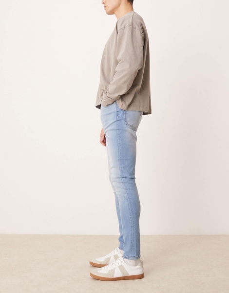 ASOS DESIGN power stretch jeans in light wash