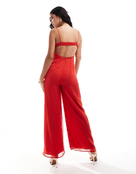 ASOS DESIGN raw edge corset paneled jumpsuit with cut out in red