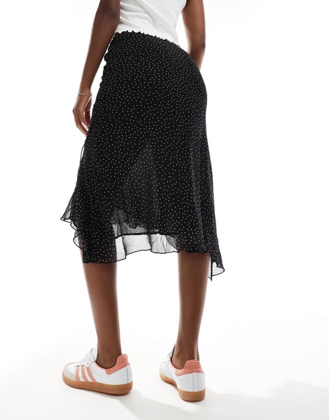 Mango asymmetric hem spot printed midi skirt in black