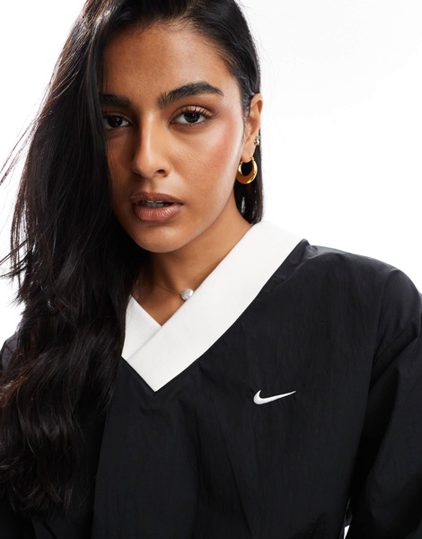 Nike Windrunner woven long sleeve crew neck top in black