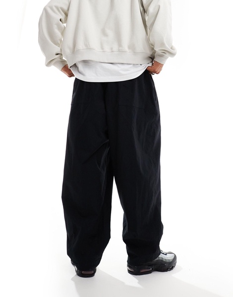 Nike Club woven balloon pants in black