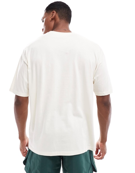 ASOS DESIGN oversized t-shirt in off white with city chest print