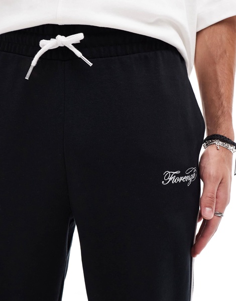 ASOS DESIGN straight leg sweatpants with embroidery and tipping details in black