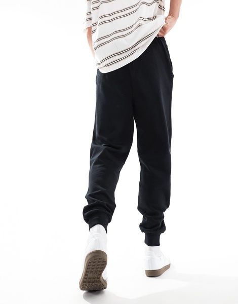 ASOS DESIGN essential tapered sweatpants in black