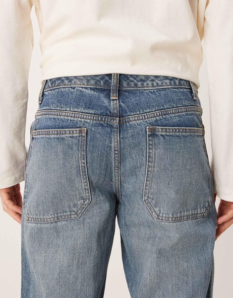 ASOS DESIGN wide flare jeans with seam detail in mid wash blue