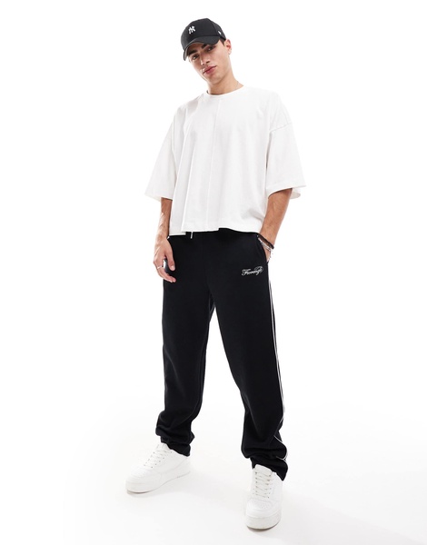 ASOS DESIGN straight leg sweatpants with embroidery and tipping details in black