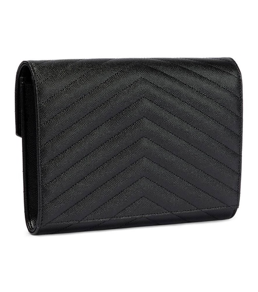 Monogram embossed leather clutch