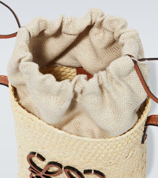 Paula's Ibiza Anagram woven bucket bag