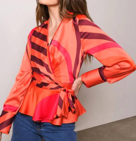 veta ruffle edge wrap blouse in coral retro geo