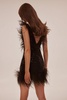 Dramatic cocktail dress on straps decorated with sequins and feathers