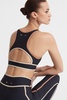 The Upside Racerback Cut-Out Sports Bra in Black