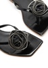 Floral-appliquéd patent leather flip flops