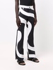 x Kenneth swirl-print trousers