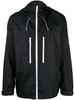 zipped-up hooded windbreaker