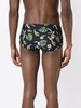 tropical-print swim trunks