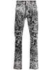 all-over graphic-print jeans