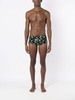 tropical-print swim trunks