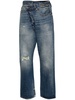 Crossover distressed skinny jeans