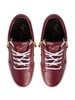 Nicki logo-patch leather sneakers