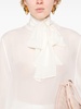 tied-neck sheer blouse