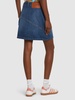 Twisted cotton denim mini skirt