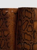 85mm Snake print leather bridge boots