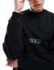 ASOS DESIGN oversized sweatshirt with text print in black