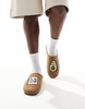 ASOS DESIGN mule slippers in tan with avocado badge