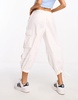 River Island Petite baggy low rise parachute pants in white