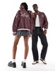 COLLUSION Unisex faux leather bomber jacket in burgundy