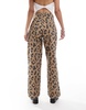 COLLUSION X002 baggy jeans in washed leopard print