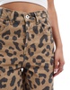 COLLUSION X002 baggy jeans in washed leopard print