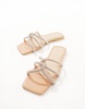 Truffle Collection embellished mules in beige