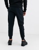 Nike Club Fleece cuffed sweatpants in black - BLACK