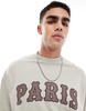 ASOS DESIGN oversized sweatshirt with chest applique in off white