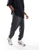 ASOS DESIGN oversized twill jersey sweatpants with pintucks in washed black